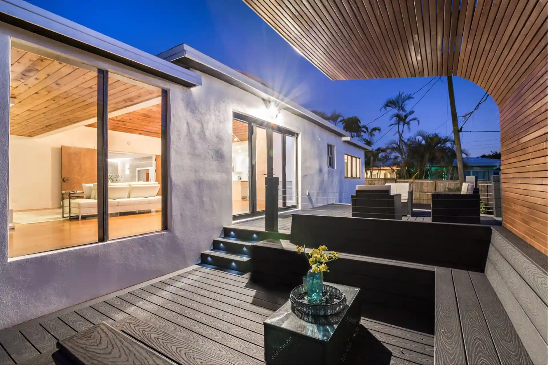 Photo of a deck and pergola with deck lighting, in-step lighting, and recessed lighting